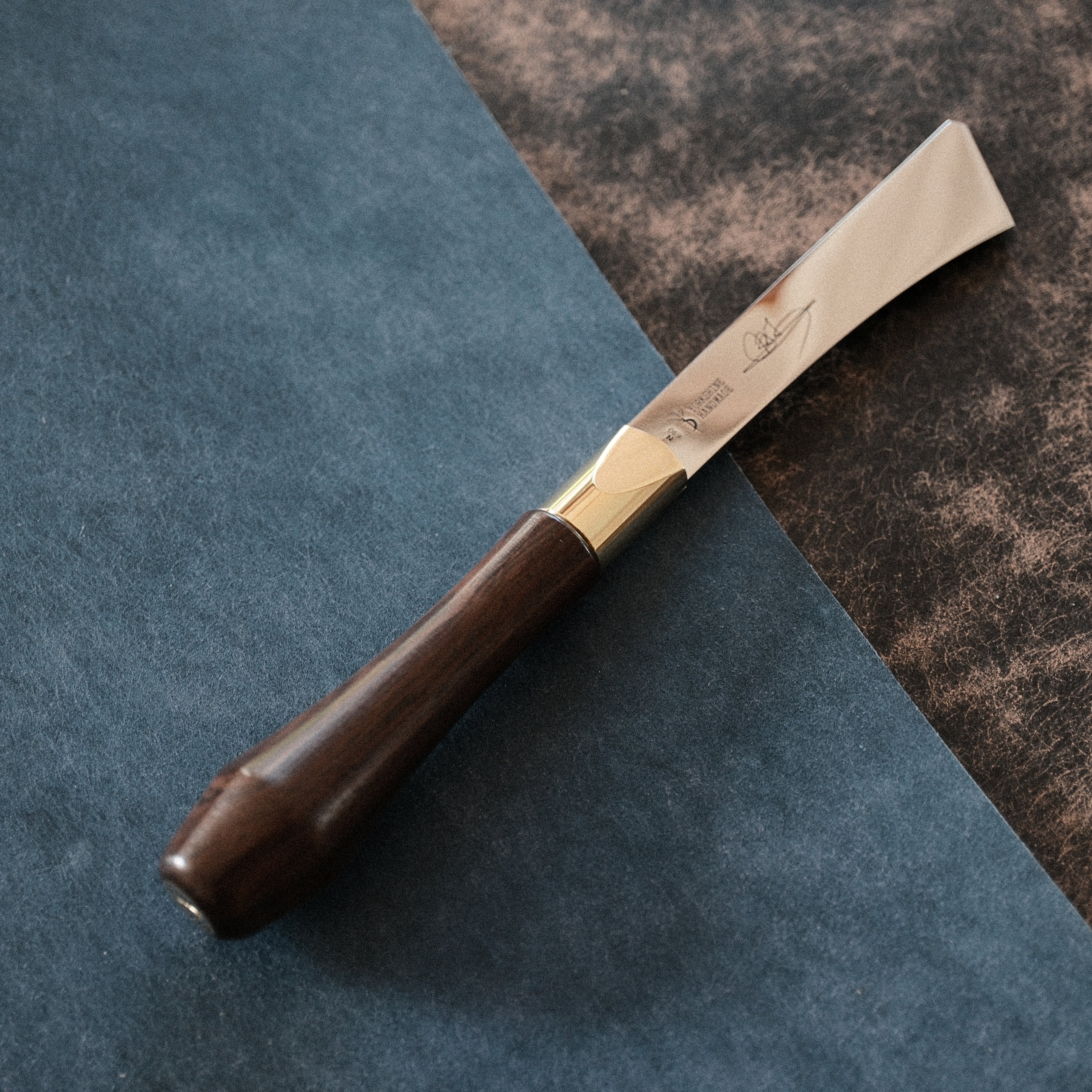 2026 upgraded Japanese long blade skiving knife with Böhler N690 stainless steel, flat-ground back, tapered blade body, walnut handle, and low-angle cutting control for clean leather skiving, thinning, and detail work. Shop now.