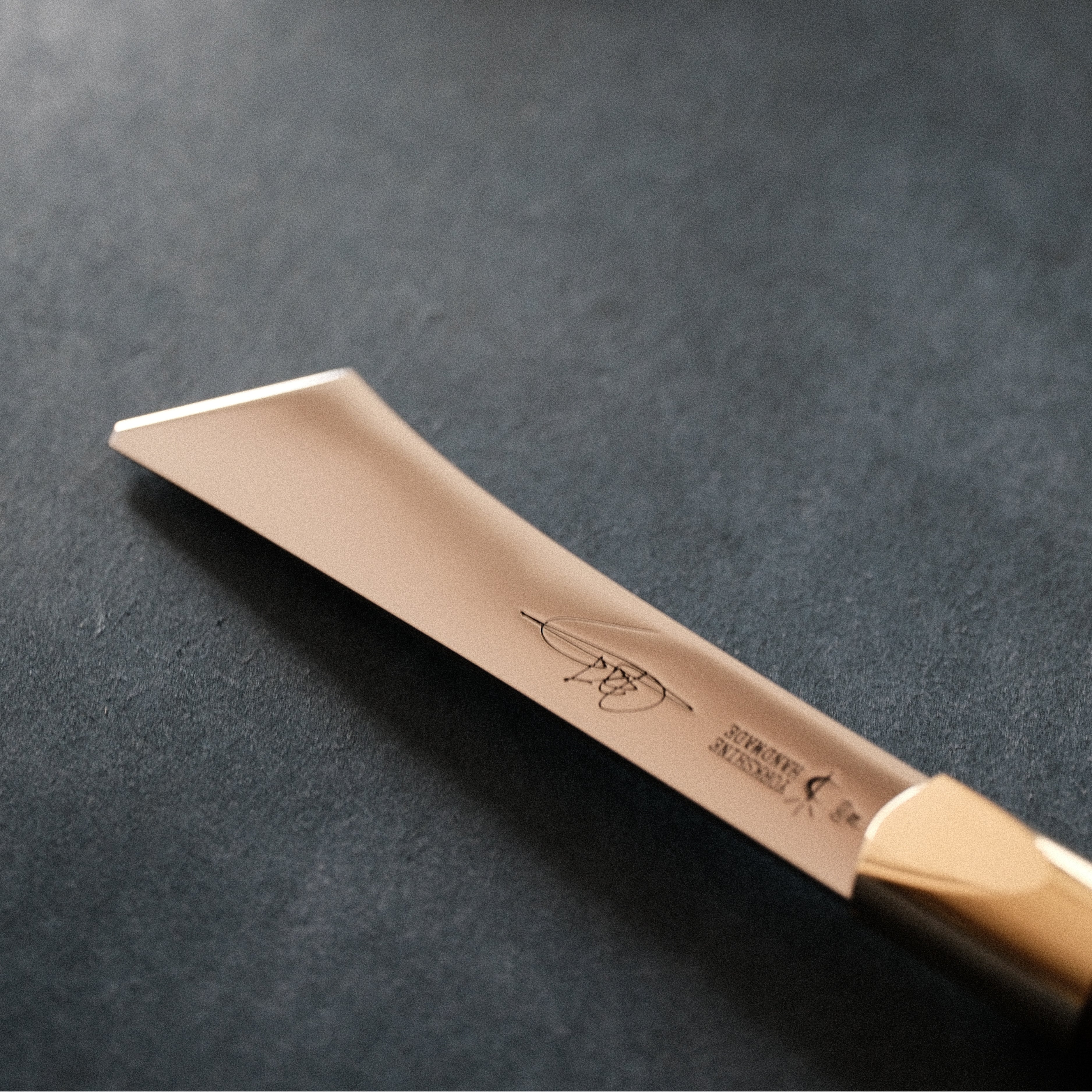 2026 upgraded Japanese long blade skiving knife with Böhler N690 stainless steel, flat-ground back, tapered blade body, walnut handle, and low-angle cutting control for clean leather skiving, thinning, and detail work. Shop now.