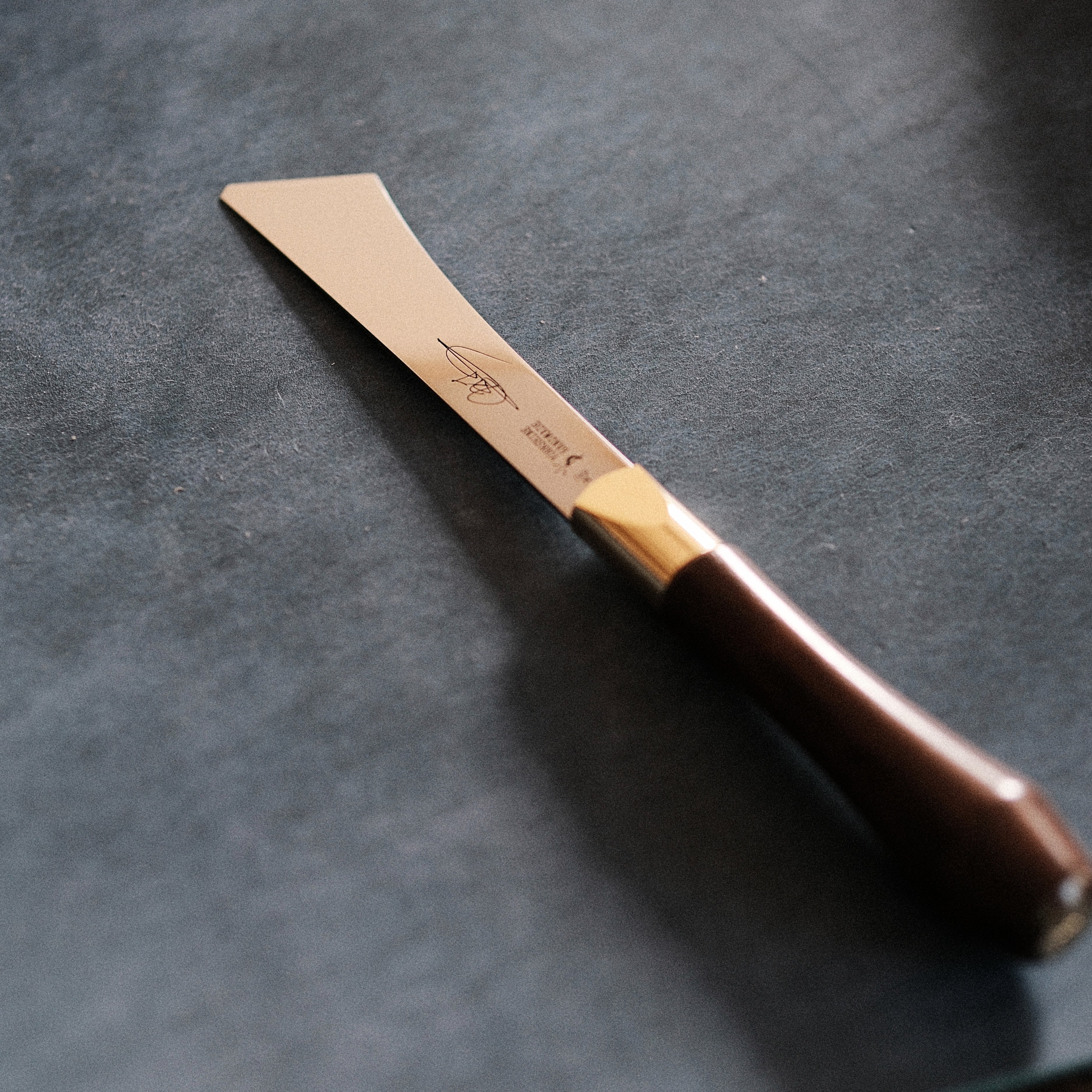 2026 upgraded Japanese long blade skiving knife with Böhler N690 stainless steel, flat-ground back, tapered blade body, walnut handle, and low-angle cutting control for clean leather skiving, thinning, and detail work. Shop now.