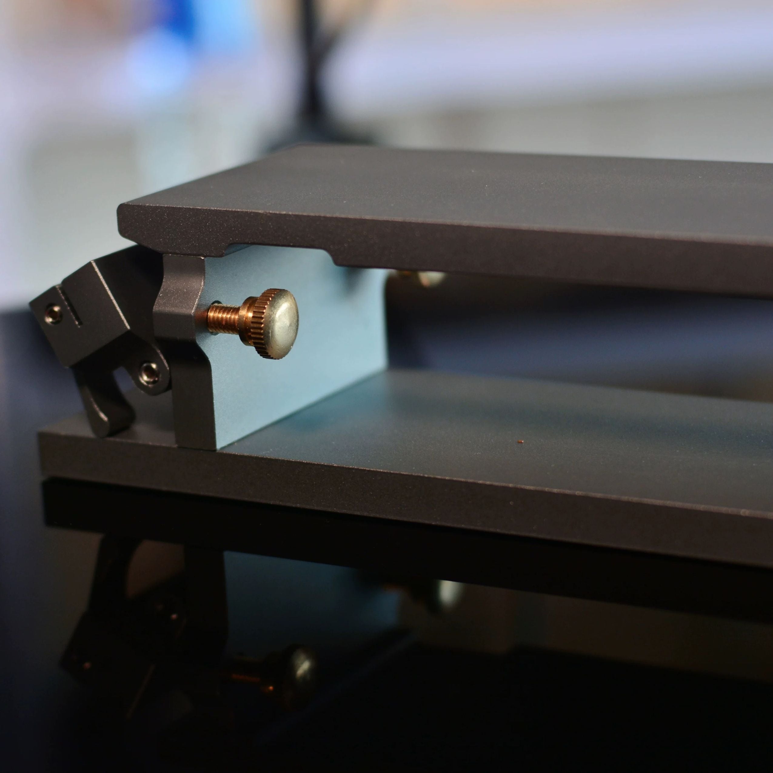 Aluminum sandpaper sharpening base for leathercraft knives and edge tools. CNC-machined with an anodized finish, non-slip silicone backing, and a flat clamping design for easier, more consistent sharpening. Includes 600, 1200, and 2000 grit sandpaper. Shop now.