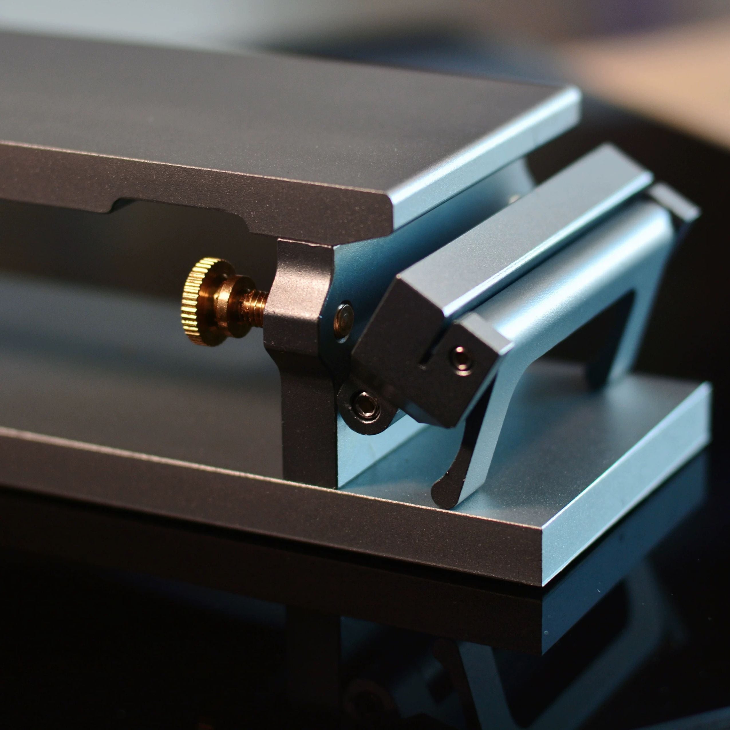 Aluminum sandpaper sharpening base for leathercraft knives and edge tools. CNC-machined with an anodized finish, non-slip silicone backing, and a flat clamping design for easier, more consistent sharpening. Includes 600, 1200, and 2000 grit sandpaper. Shop now.