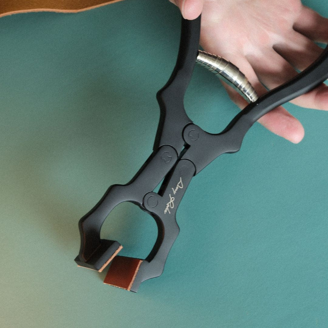 Amy Roke Flat-Jaw Leathercraft Pliers offer precise clamping for hand-stitching and edge work. Made from heat-treated alloy steel for durability and a firm grip. Includes a BIRENA calfskin handle wrap for added comfort. Perfect for leatherworkers. Get yours today!