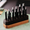 Taiwan-made Bangbang hex round punch set for leathercraft. High-toughness special alloy steel punches with black finish and wooden base, ideal for clean belt holes, hardware holes, and round leather punching.