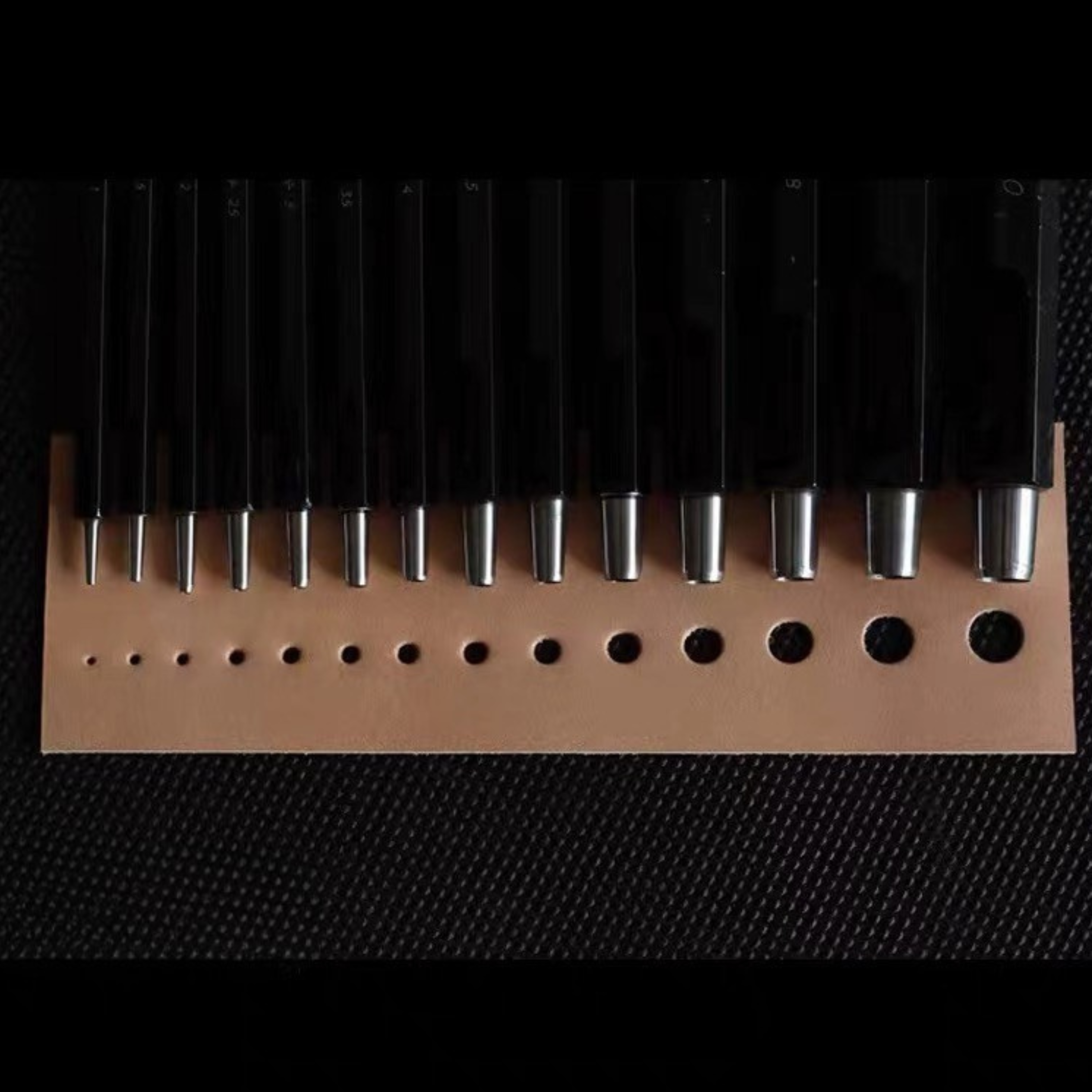 Taiwan-made Bangbang hex round punch set for leathercraft. High-toughness special alloy steel punches with black finish and wooden base, ideal for clean belt holes, hardware holes, and round leather punching.