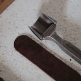 CÍ × bangbang DC53 Leather Belt End Punch, a leathercraft strap end punch for clean, accurate belt tips. Japanese DC53 tool steel, heat-treated for a sharp, durable edge, test-cut before shipping, and built for long-term use. Order yours today.