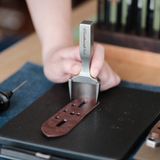 CÍ × bangbang DC53 Leather Belt End Punch, a leathercraft strap end punch for clean, accurate belt tips. Japanese DC53 tool steel, heat-treated for a sharp, durable edge, test-cut before shipping, and built for long-term use. Order yours today.