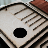 Leather pencil roll cutting die with integrated stitching holes, Japanese steel blade, and wood or acrylic base. Designed for clean, repeatable cutting with a protective pencil-tip flap. Custom layouts available for leathercraft projects. Order yours from CÍ.