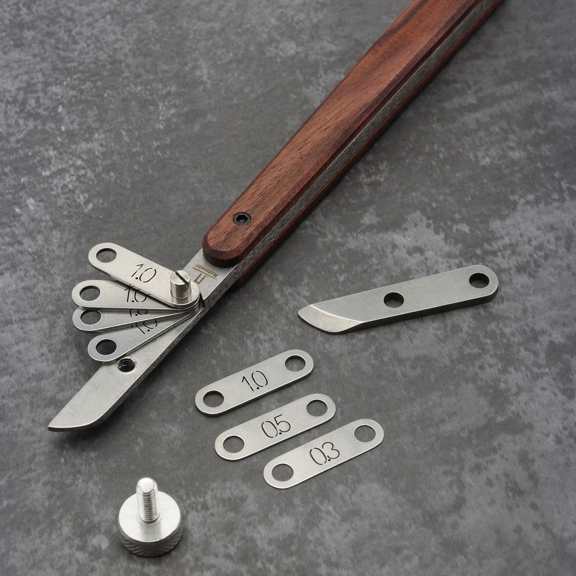 Adjustable leather edge creaser for clean, consistent stitch-line marks. Shim-based spacing lets you dial in perfect lines for belts, wallets and straps. 304 stainless body, stone-washed finish, walnut handle for comfort and control. Get steadier edges—shop now.