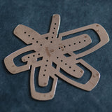 A leather strap end template for marking rounded and tapered ends on belts, watch straps, bag straps, and shoulder straps. Covers common strap widths with guide holes for cleaner positioning and smooth, consistent layout. Shop now.