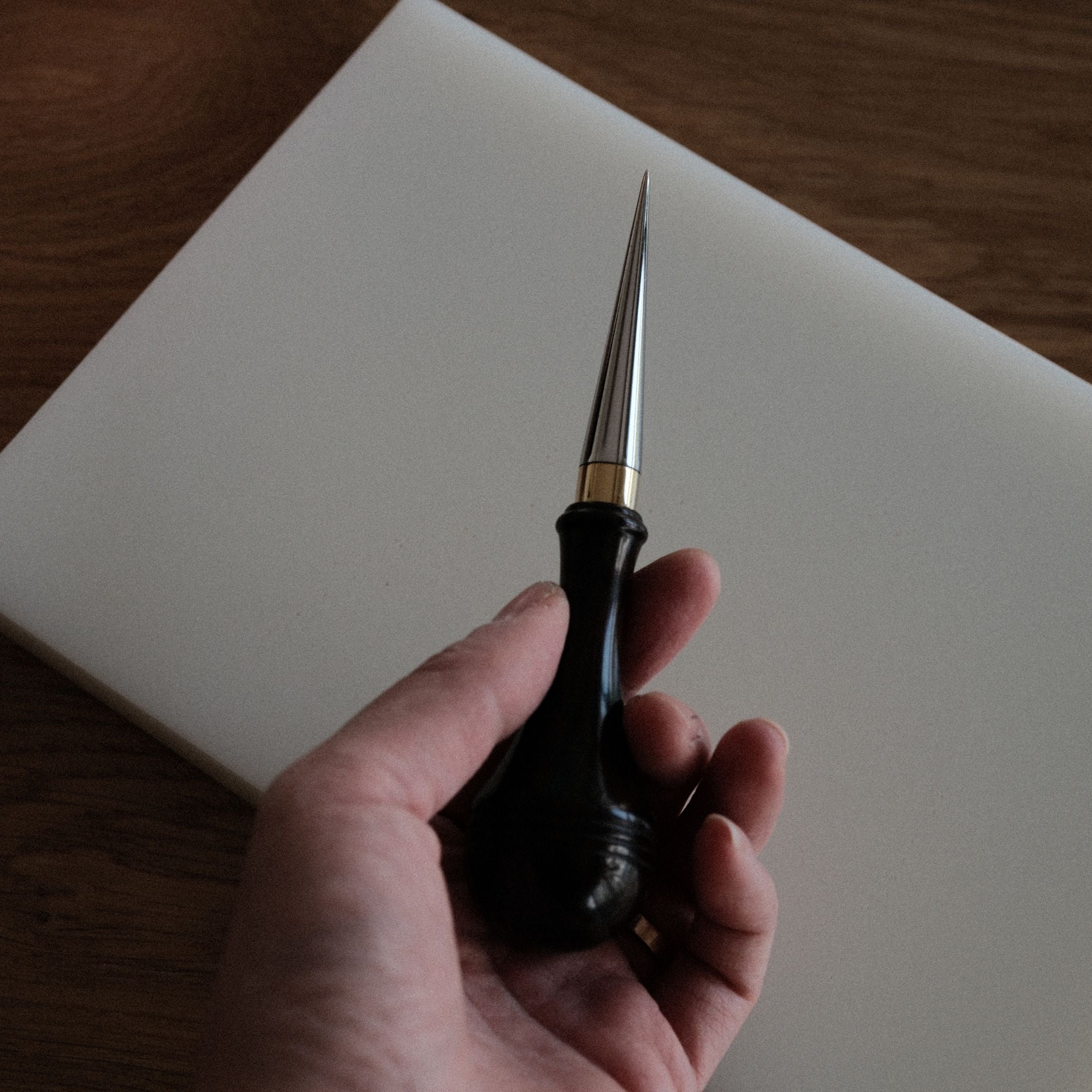 Leathercraft scratch awl for marking lines, opening holes, and widening stitch holes. Made with a solid 304 stainless steel tip and rosewood handle for balanced everyday use in hand stitching and leatherworking. A useful bench tool for daily leathercraft work. Shop now.