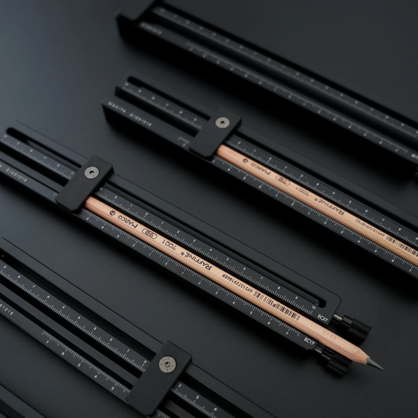 Adjustable pencil holder designed for MAXITA hot foil stamping machines. Made from durable aluminum alloy with clear scale markings for precise alignment. Compatible with EC-17 and EC-27. Ideal for pencil foil stamping. Explore now or contact us to confirm compatibility.