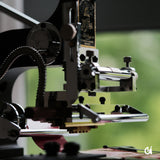 The MOVEGO Vintage-Style Hot Foil Stamping Machine is a compact desktop foil stamping machine for leather, paper, PVC, and small-batch custom work. With its film-camera-style foil loading, metal-and-wood body, clamp, infrared guide, and worktable, it brings a more tactile and enjoyable way to stamp logos, names, and simple design details.