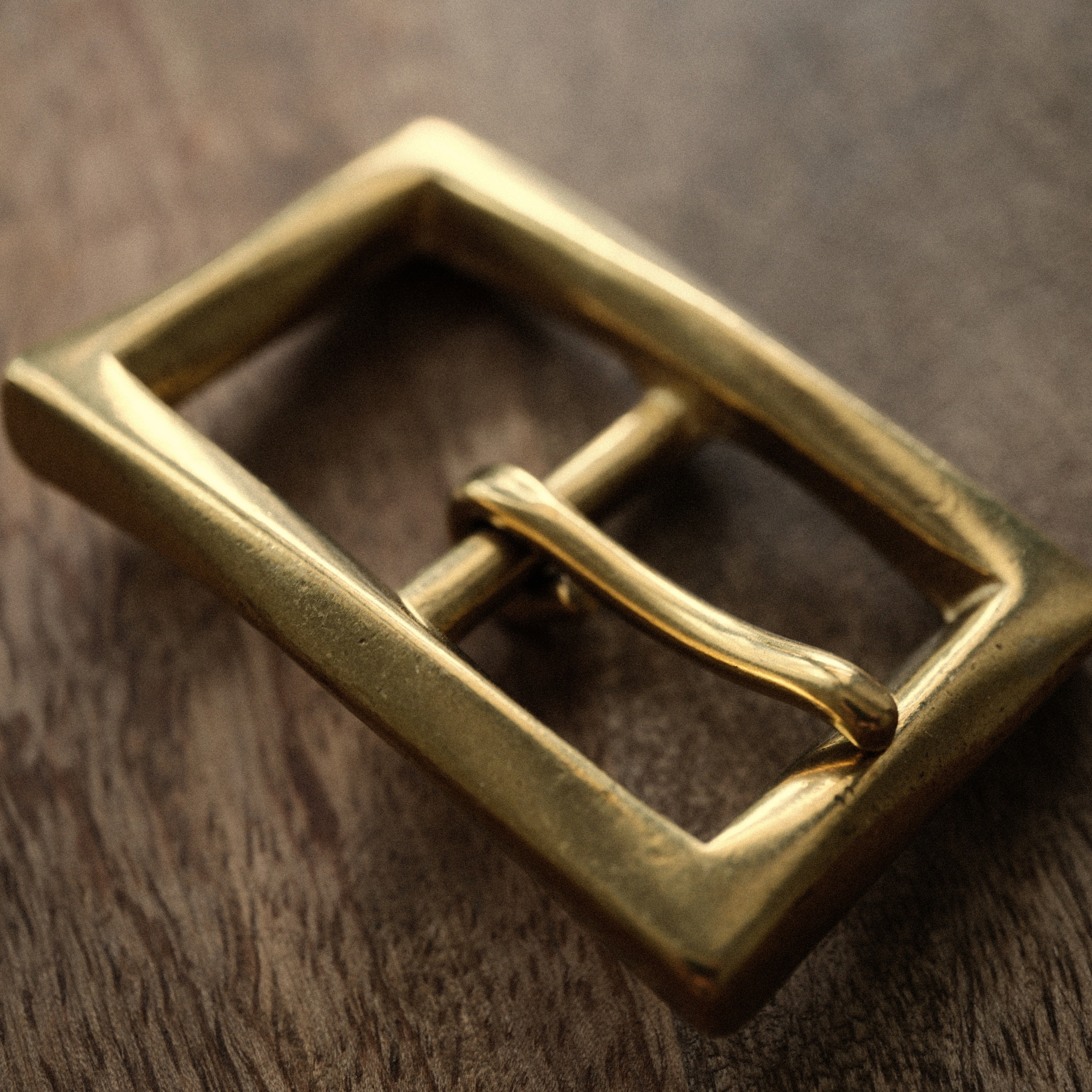 Made in Japan solid brass belt buckle for 25mm leather straps. Sand-cast, naturally aged and supplied with two matching brass screws for handmade belt projects.