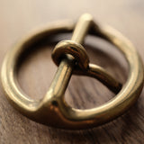 Made in Japan from solid brass, this round leather buckle has a sand-cast, tumble-finished surface that develops a natural patina over time. A practical choice for handmade belts, bags and vintage-style leathercraft. Shop Japanese brass hardware at CÍ.