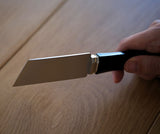 Precision leathercraft knife made with Böhler M390 powder steel for clean cutting, beveling, and fine decorative grooves. Features an ergonomic purple sandalwood handle and balanced HRC 60–62 hardness. Built for serious leatherworkers. Explore the tool today.
