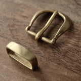 Solid brass belt buckle and keeper set with a clean, understated shape and an uncoated finish that develops a natural patina over time. Ideal for handmade leather belts, repairs and classic leathercraft projects. Shop solid brass belt hardware at CÍ.