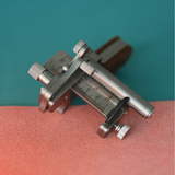 This modern leather strap cutter, developed in collaboration with Nattools, combines a rotating wheel with an automatic spring-back mechanism for smooth, consistent cuts on leather.