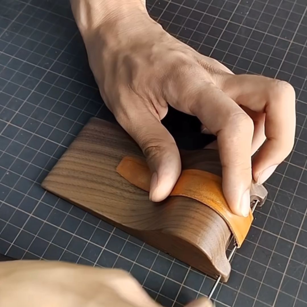 Crafted from premium black walnut wood, this strap molding tool is designed to shape watch straps without damaging the leather surface. The latest version features a polished finish with a wood wax oil coating, giving it a smooth, refined look.