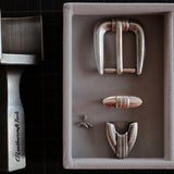 A 25mm American vintage 3-piece belt buckle set with engraved detailing and an antique silver-tone finish. Includes the buckle, keeper loop, and belt tip. Best used with leather straps around 25mm wide and 4mm thick.