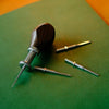 Detachable T-Awl set features high-quality 304 stainless steel body and DC53 tool steel blades for durability. Its easy-to-use slot design ensures stability and quick blade changes. Ideal for precise stitching and hole punching in leathercraft. Enhance your work with this reliable tool.