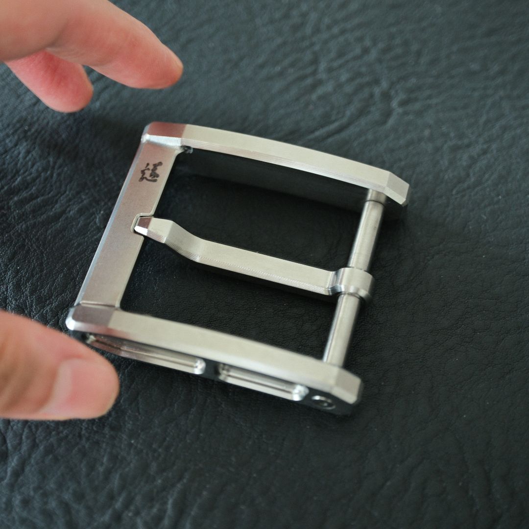 Incorporating a titanium pin into a belt buckle design offers numerous benefits, from enhanced durability and comfort to a sleek, modern aesthetic.