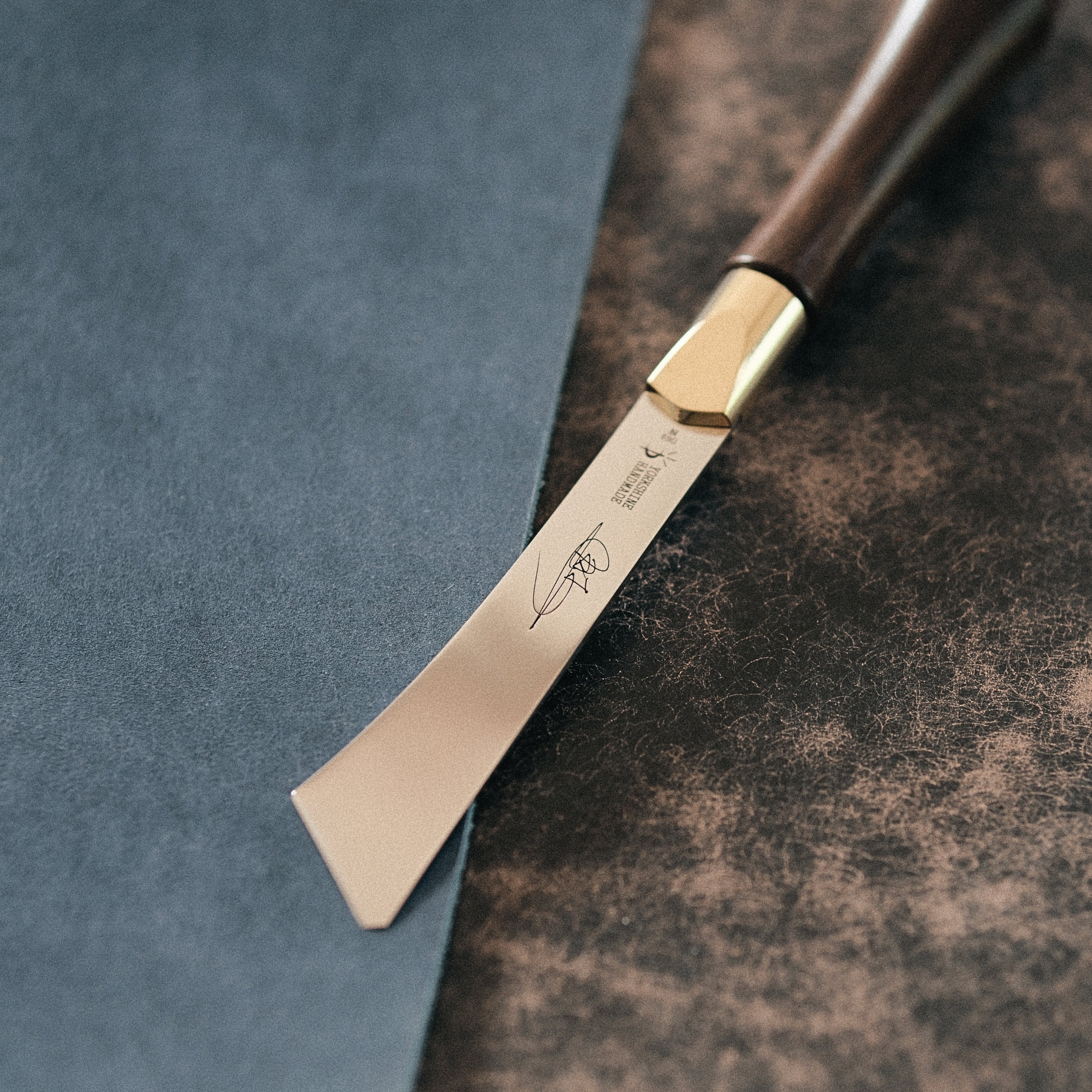 2026 upgraded Japanese long blade skiving knife with Böhler N690 stainless steel, flat-ground back, tapered blade body, walnut handle, and low-angle cutting control for clean leather skiving, thinning, and detail work. Shop now.