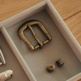 A 25mm antique brass single prong belt buckle for handmade leather belts, straps, bags, and leathercraft projects. Comes with 3 matching screws, so you have the basic hardware ready for installation.