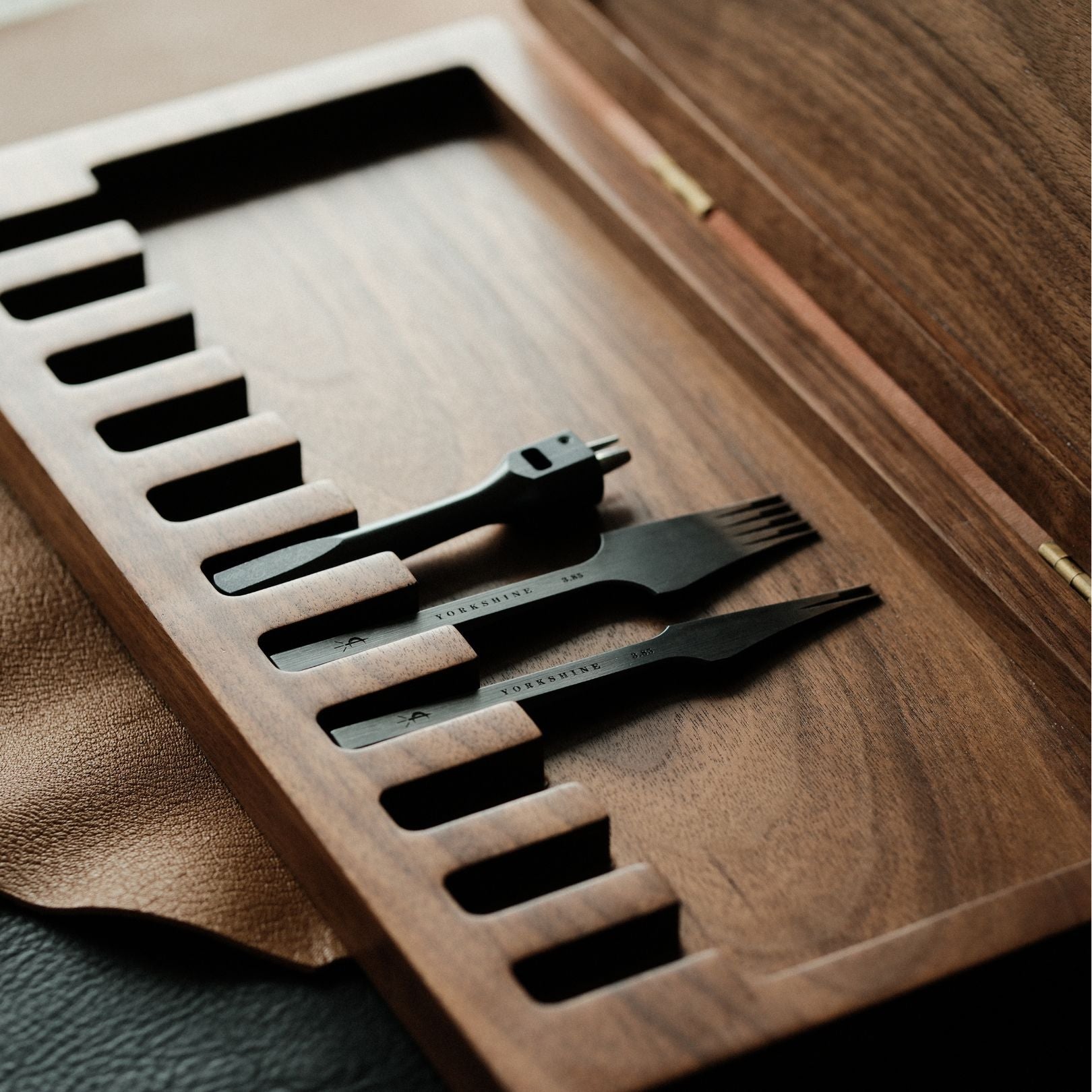 Keep your pricking irons and punches organized with this 11-slot black walnut tool box. Fits most common brands, protects tools from dust, and adds a clean look to your workbench. A solid storage upgrade for leathercrafters—grab yours now.