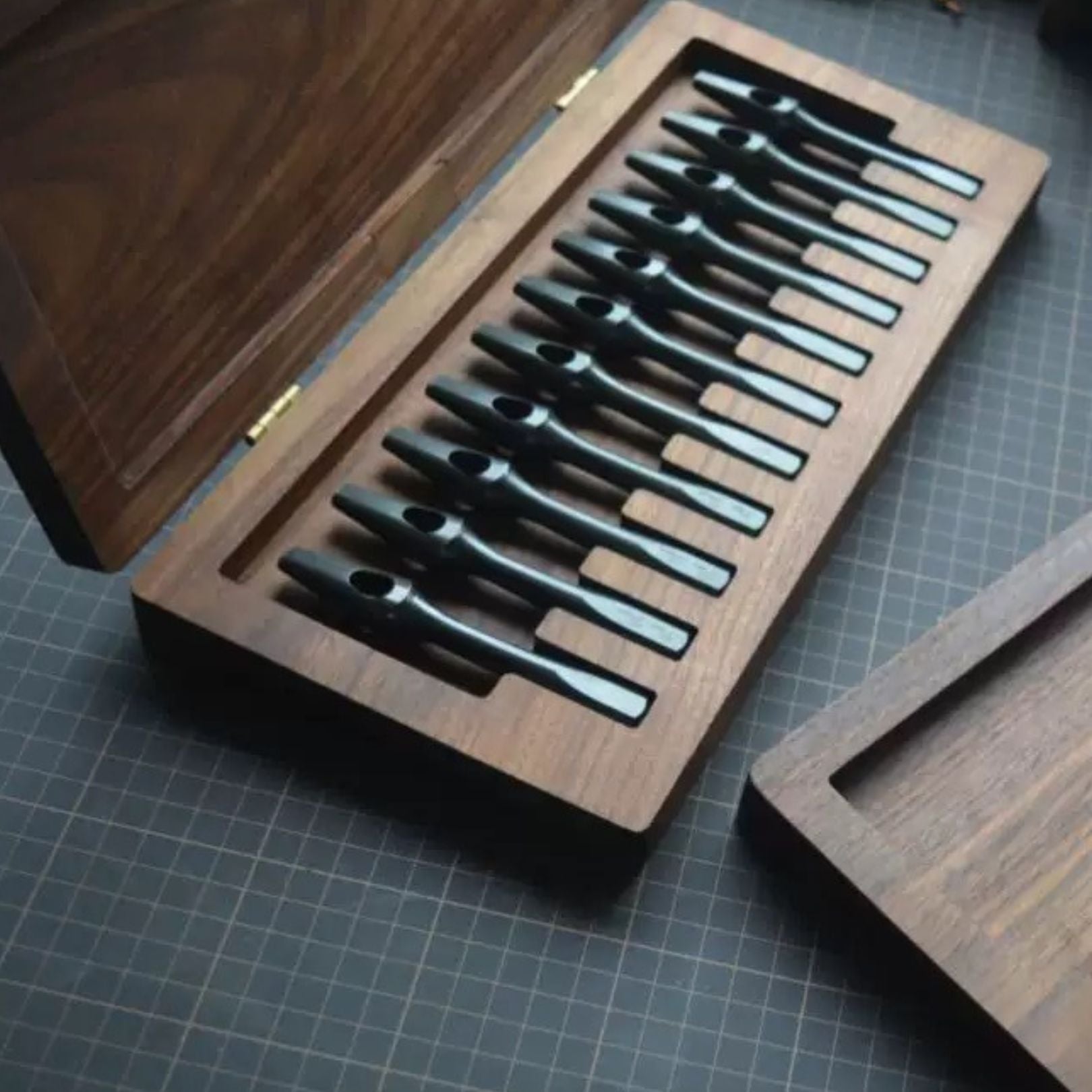 Keep your pricking irons and punches organized with this 11-slot black walnut tool box. Fits most common brands, protects tools from dust, and adds a clean look to your workbench. A solid storage upgrade for leathercrafters—grab yours now.