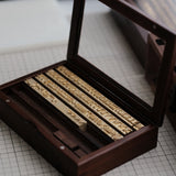 CÍ deluxe brass hot foil stamping type set with walnut storage box, designed for clear leather embossing, custom branding, luggage tags, labels and packaging. Compatible with Maxita Holder No. 1 and MOVEGO machines. Custom fonts available. Shop now.
