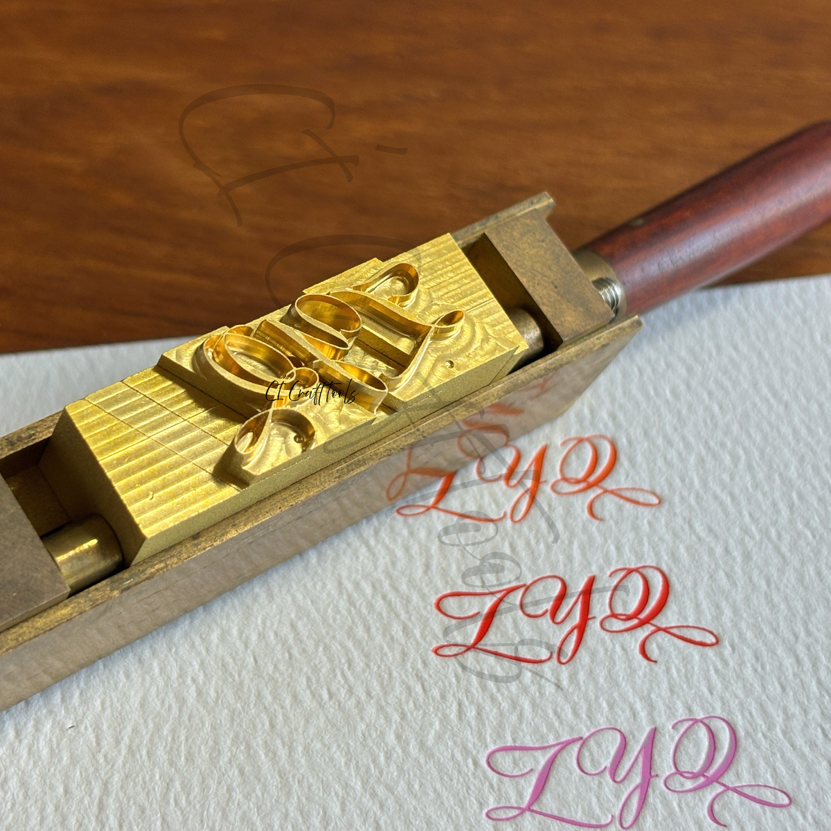 A custom brass type system made for script, calligraphy, italic and decorative fonts that do not sit neatly on a standard type base. Designed for long tails, swashes and complex letterforms, with specially adjusted type heights, blank spacers and side locking blocks to keep spacing more natural and the type secure in the holder.Suitable for hot foil stamping, blind embossing and personalised leather or paper goods.