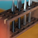 Perfectly aligned holes ensure secure and accessible storage for a wide range of tools, from pricking irons to stitching chisels