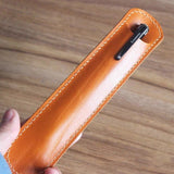Custom leather pen sleeve cutting die with Japanese steel blade, wooden base, and built-in stitching holes. Made for clean cutting, accurate hole placement, and custom leather pen case production.