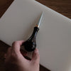 Leathercraft scratch awl for marking lines, opening holes, and widening stitch holes. Made with a solid 304 stainless steel tip and rosewood handle for balanced everyday use in hand stitching and leatherworking. A useful bench tool for daily leathercraft work. Shop now.