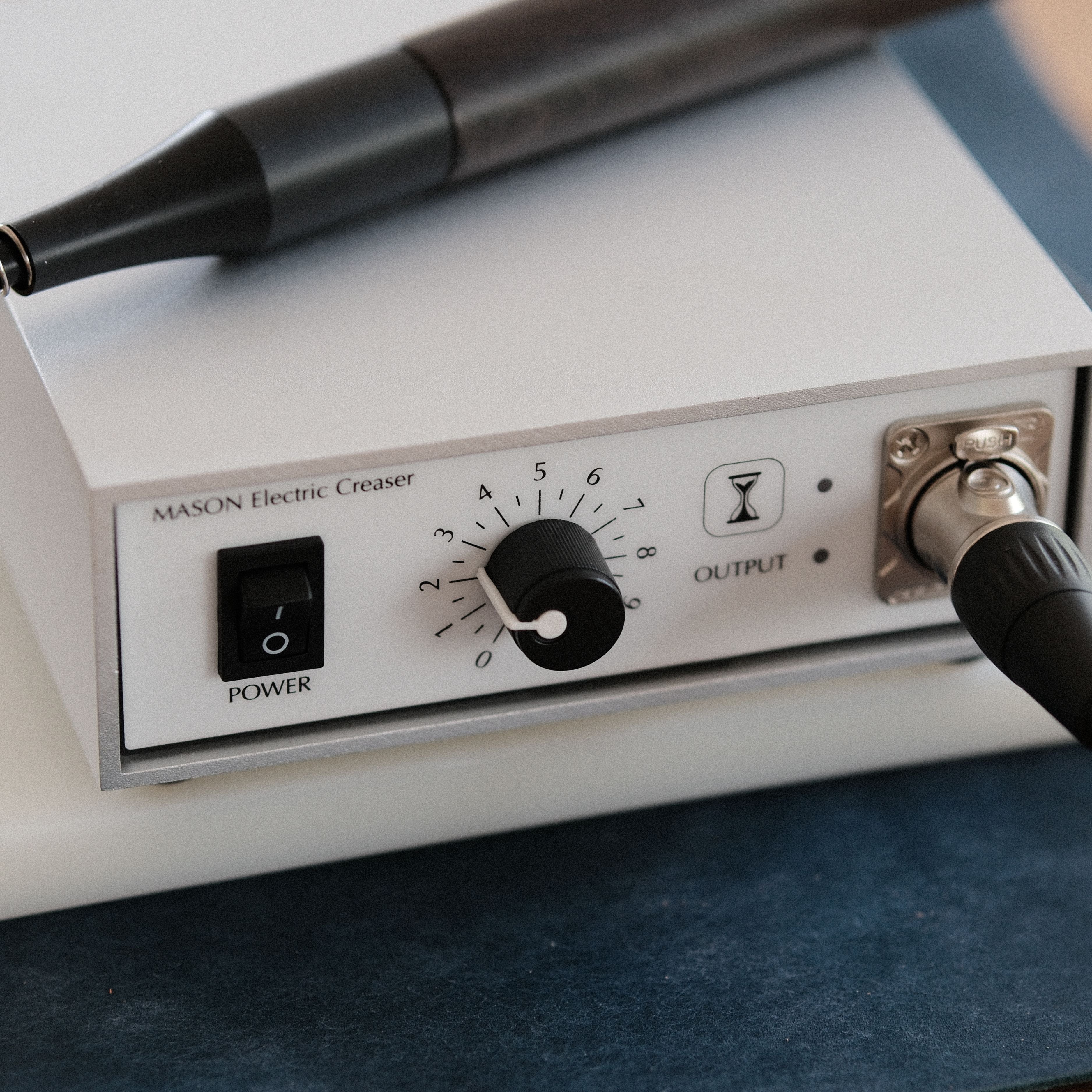 M60 Electric Leather Edge Creaser Set for clean leather creasing, edge finishing, edge paint smoothing, waxing, and detail work. Features stepless temperature control, CE certification, ebony handpiece, auto shut-off, walnut stand, and multiple tips. Explore M60 for refined leather edges.
