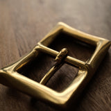 Made in Japan solid brass belt buckle for 25mm leather straps. Sand-cast, naturally aged and supplied with two matching brass screws for handmade belt projects.