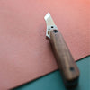 Nattools leather cutting knife features a DC53 steel blade with a vintage washed finish, ensuring sharp, precise cuts.