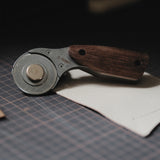 Cut leather more safely and smoothly with the Nattools rotary leather cutter. Features a retractable replaceable blade, stainless steel body, comfortable wooden handle, and safety lock for cleaner strap, bag, and pattern cutting. Shop now.