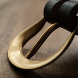 Solid brass belt buckle and keeper set with a clean, understated shape and an uncoated finish that develops a natural patina over time. Ideal for handmade leather belts, repairs and classic leathercraft projects. Shop solid brass belt hardware at CÍ.