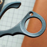 Stainless steel needle pulling pliers for leather hand stitching. Compact one-hand design with finger ring, spring-back jaw, and serrated flat tips to grip stuck needles through thick leather or tight stitch holes. Shop now.