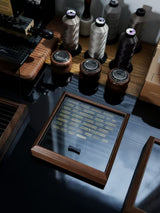 The glass lid can be placed on top to keep out dust, or slotted into the back for quick access and a cleaner look