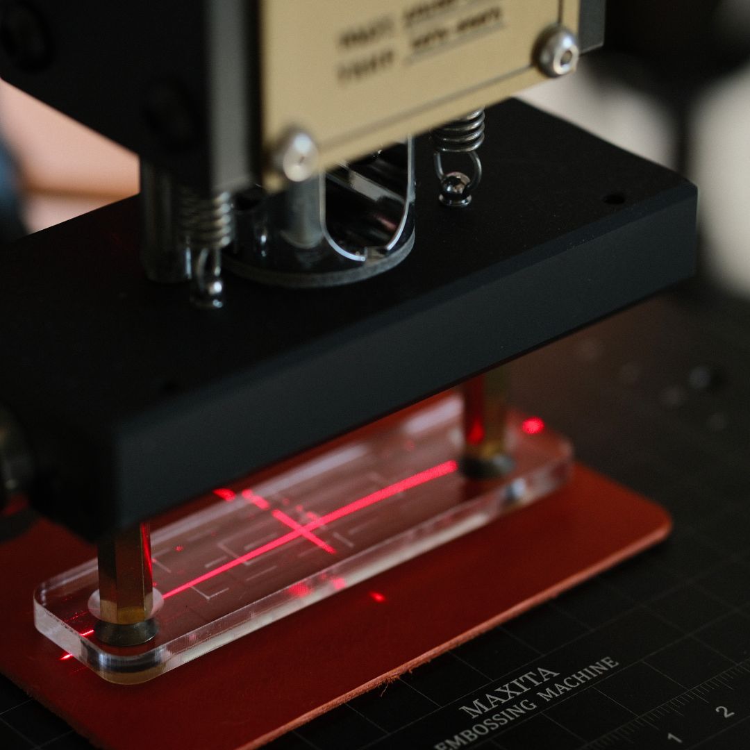 This transparent acrylic holder is perfect for previewing and aligning your design before the final embossing.