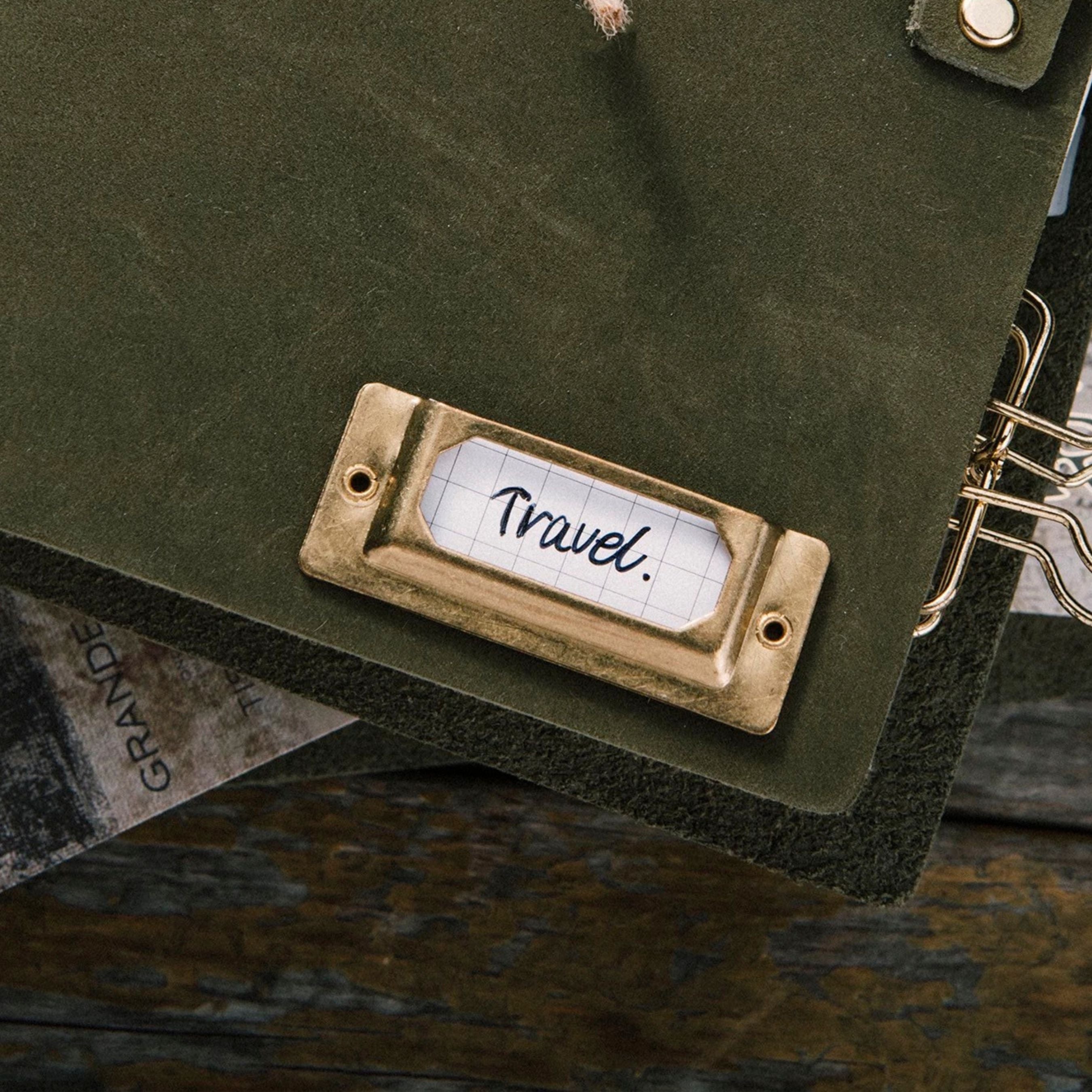 Vintage brass label holder for journals, notebook covers, bookmarks, traveler’s notebooks, Bibles, and scrapbooks. A simple brass detail for labeling or finishing paper and leather projects with a classic look. Add it to your next project.