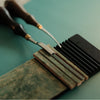 Sharpen your Yorkshine skivers, bevelers, and knives with this CNC aluminum board. Comes with pre-cut veg-tan leather and 3M adhesive. Compact, stable, and easy to use—ideal for everyday leatherwork. Try it on your desk or on the go.