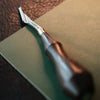 Craft clean, smooth grooves with the Yorkshine Leather Groover. Made with cryo-treated DC53 steel and a walnut handle, it's sharp, comfortable, and built to last. Ideal for precise leatherwork. Shop now for pro-level results.